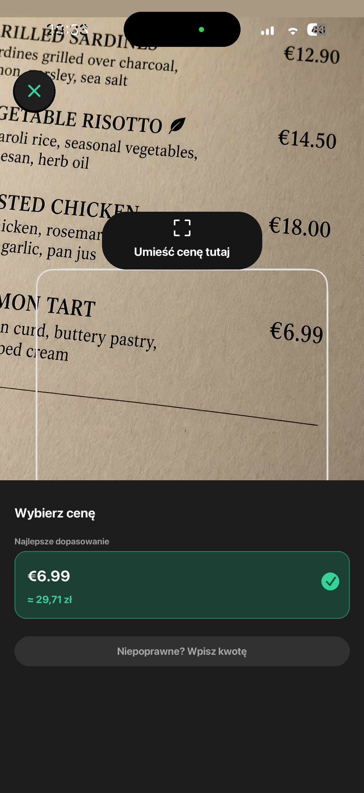 Currency Converter Lens odczytuje cenę 6,99 euro z menu i pokazuje przybliżoną kwotę w koronach duńskich